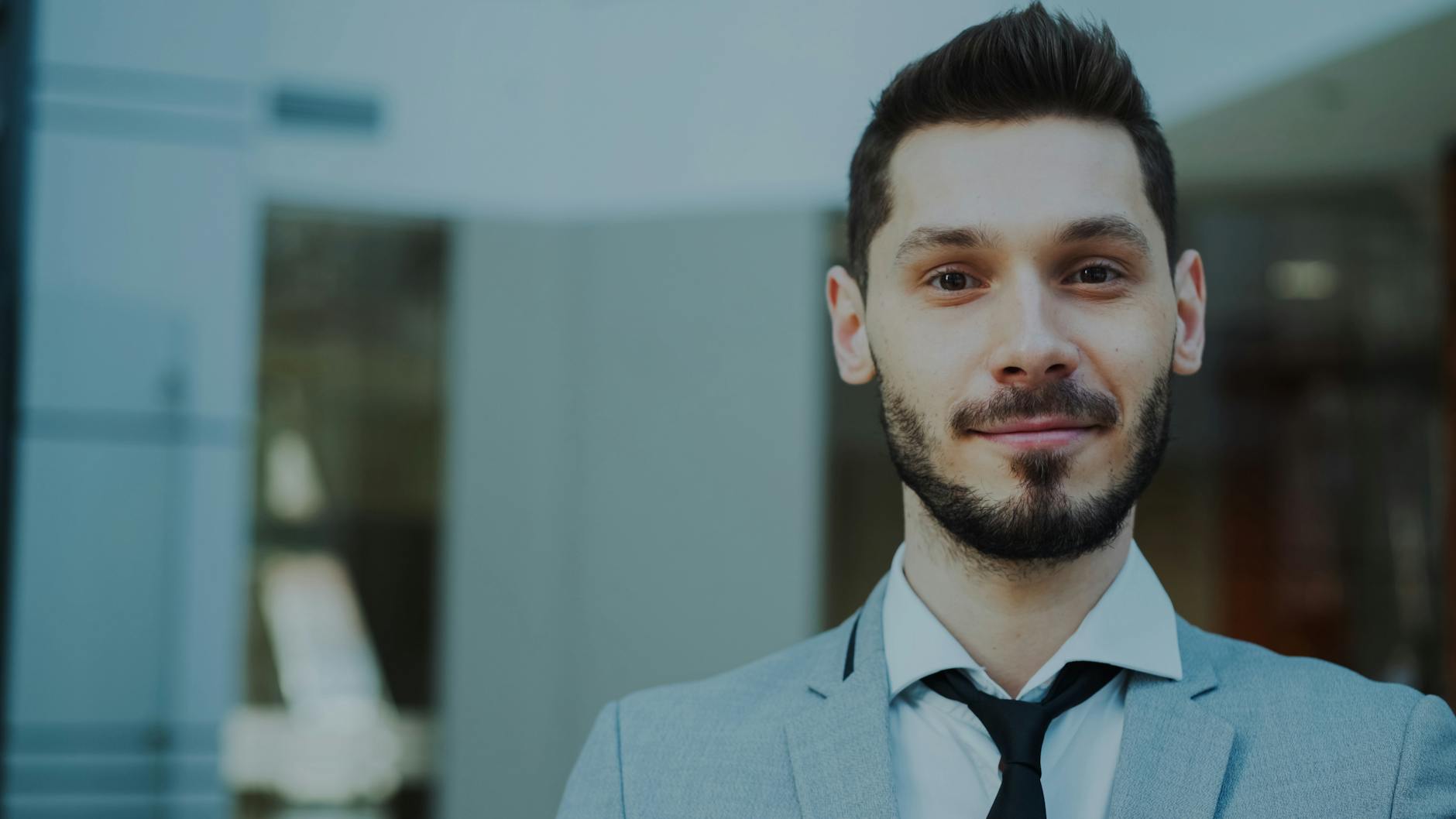 Portrait of a confident business professional in a modern office setting.